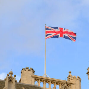 Union Flag flying over a historic stone building